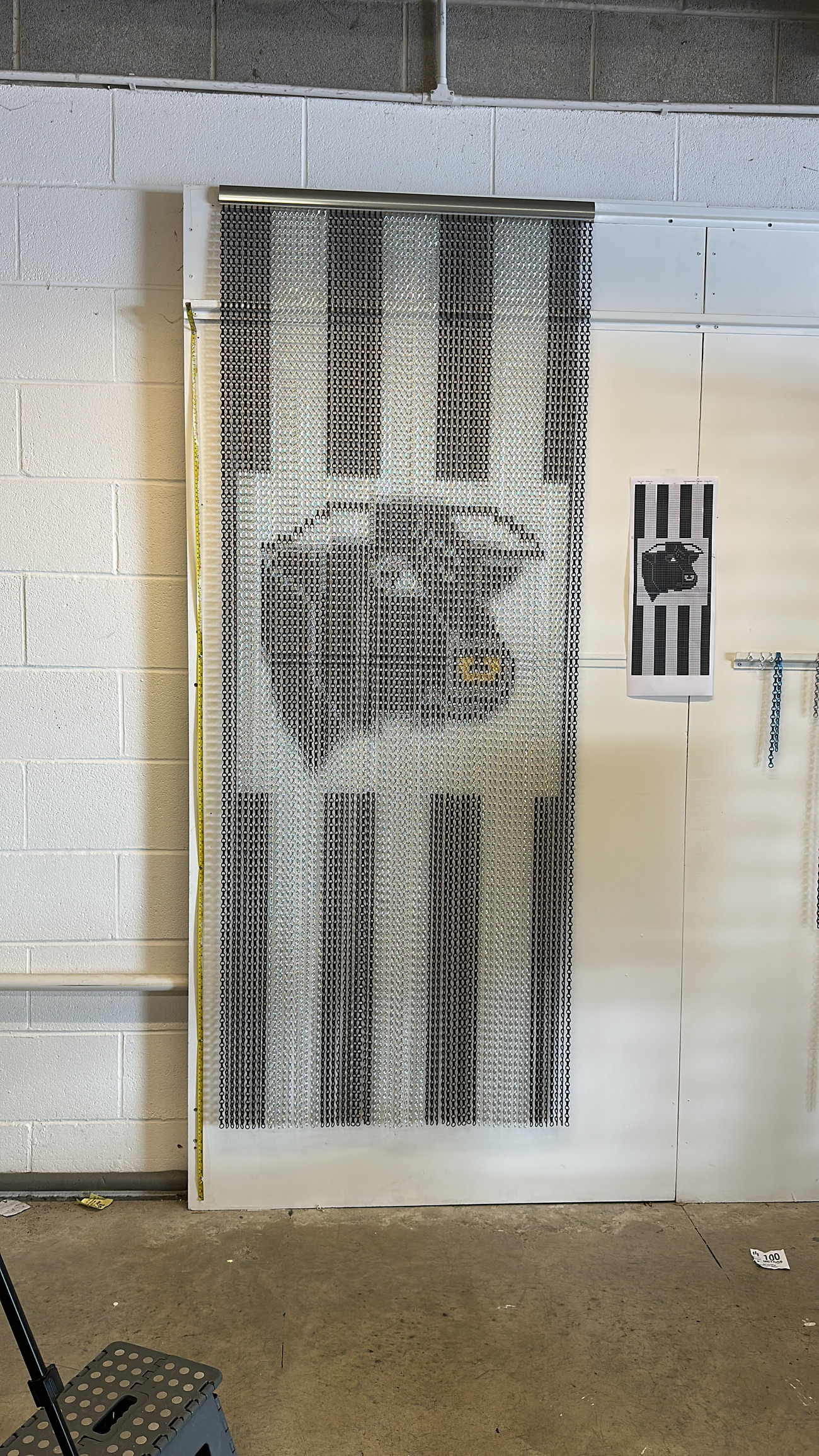 Bulls head aluminium chain fly screen curtain. Black and silver stripes. Fully customised to the customers specification. Made to measure and available in any of our 17 colours.