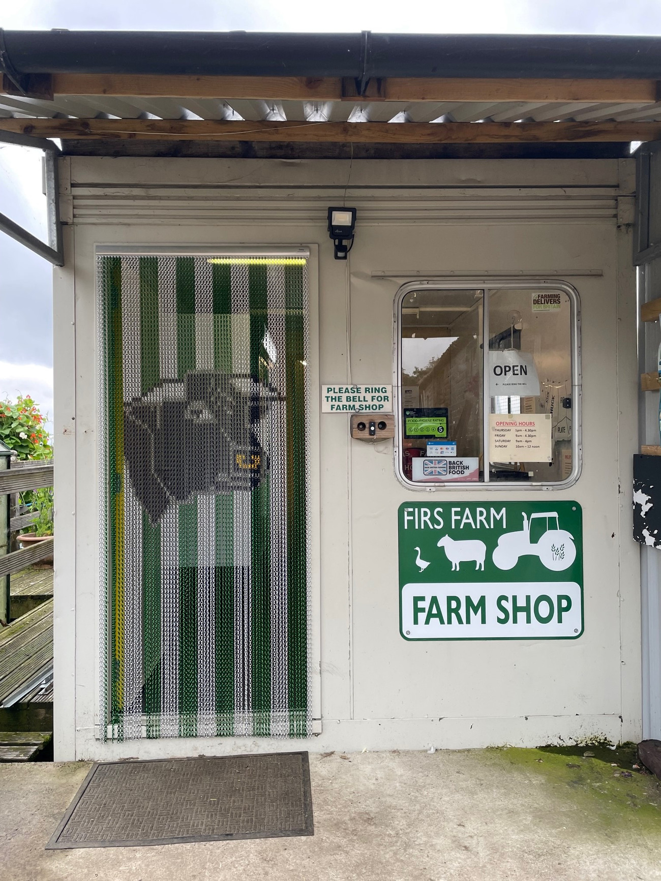 A Screen that was made for a Customer - Forest Green and Silver Thick Stripe with a bulls head to hang at the front of their farm shop for pest protection.