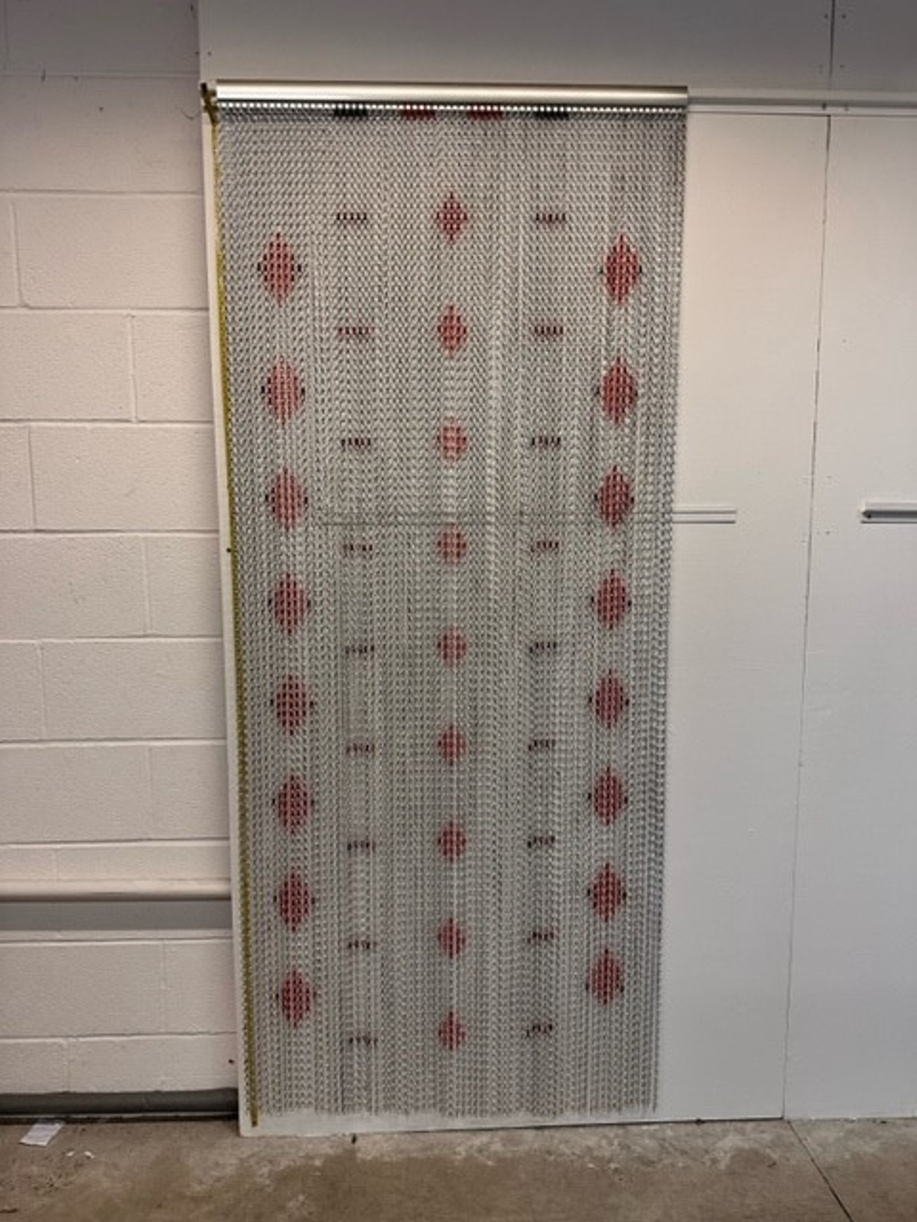 Silver chain fly screen with a red diamond design. This screen can be used indoor and outdoor and is made with high grade aluminium chain which gives the best protection against flies, bees, wasps and other pests that you don't want to enter your property