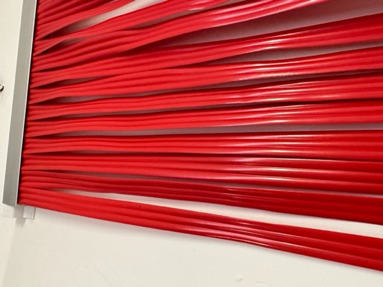 Red PVC Screen can be used indoors or outdoors. The strands cover the full screen.