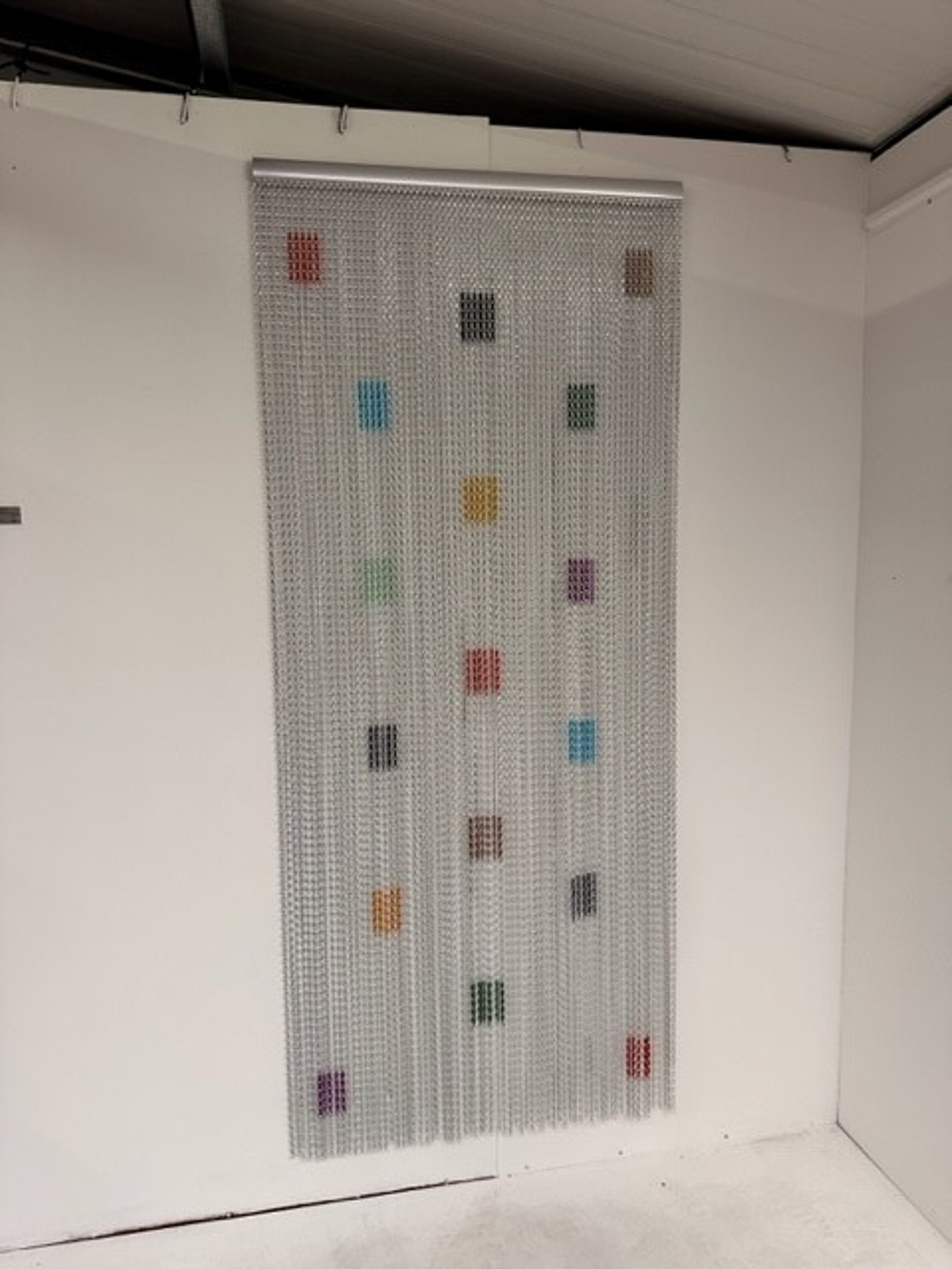 Silver chain fly screen with mixed colour squares - Colours included Standard and Premium. Can be used indoors or outdoors and will prevent pests, insects, bugs, flies, bees and wasps from entering your home or workplace. Can be used in a domestic or commercial location. Made using high grade aluminium chain.