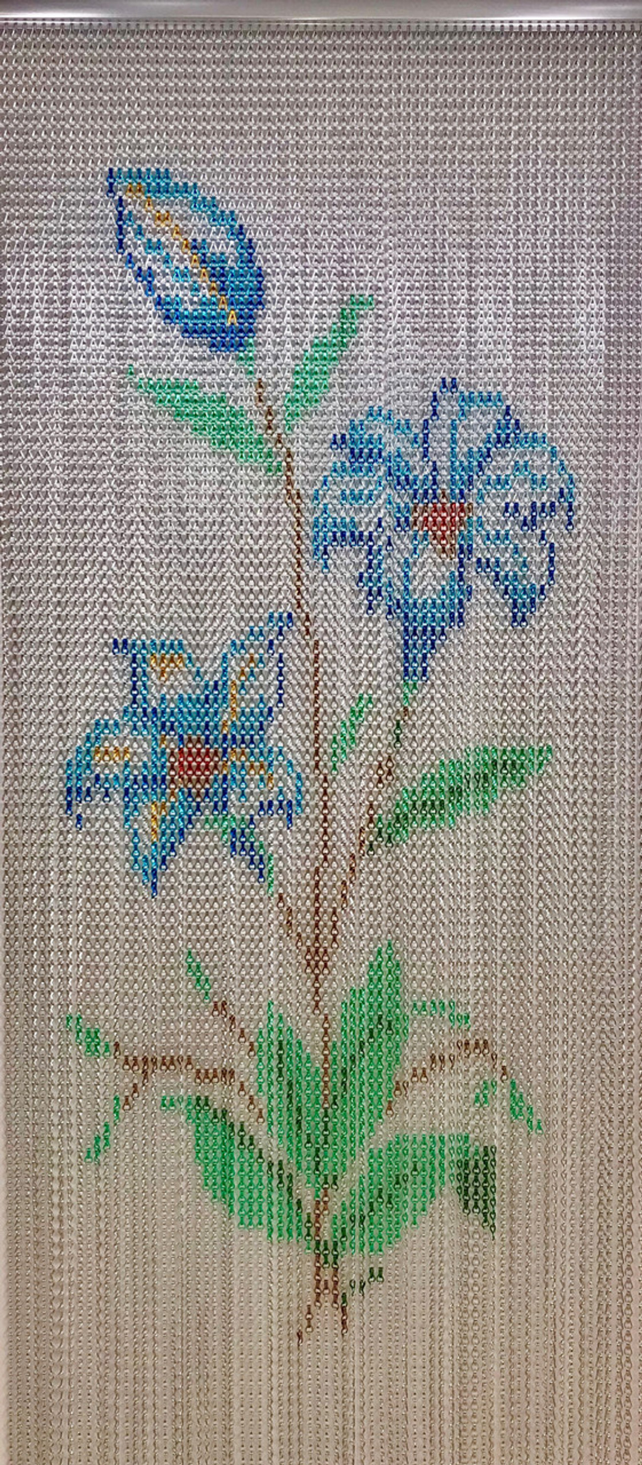 Lily Patterned Chain Screen. This screen is suitable for domestic or commercial properties and is an attractive alternative to a plain fly chain screen. The lilies pattern screen has a mix of standard and premium colours mixed to create the pattern. The screen can be provided in 2 widths and can be trimmed to suit your opening. Lily Patterned Chain Screen. This screen is suitable for domestic or commercial properties and is an attractive alternative to a plain fly chain screen. The lilies pattern screen has a mix of standard and premium colours mixed to create the pattern. The screen can be provided in 2 widths and can be trimmed to suit your opening.