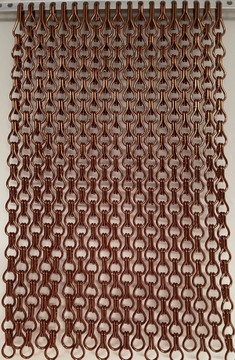 Bronze Close Knit. The pattern on the screen is made due the density of the screen being 22% more than a standard chain screen offering more protection.