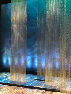 London theater production created with silver chain to make large screens to fit floor to ceiling.