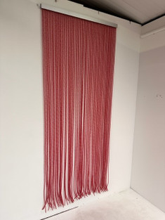 Red PVC Twist curtain for pest control. Suitable for commercial and domestic settings. Stops flies, pests, bees and wasps from entering your property. Clearance item.This screen hangs on doors to stop flies coming into your home or business.