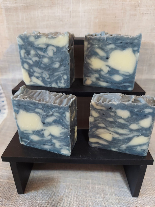 These soaps have a black, gray, white and blue swirl pattern.