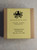 Image shows packaging that product is sold in -- a brown paperboard box with a yellow label.