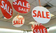 Don’t Ignore Your Walls: Ways Hanging Signage Drives Sales