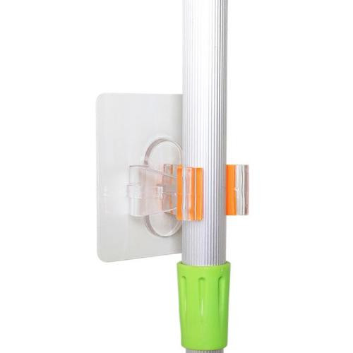 Clear holder featuring safety-orange rubber non-slip grippers prevents scratches and movement of items pressed into place.
