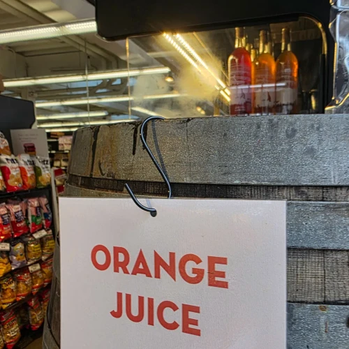A sign for a food stand in a store