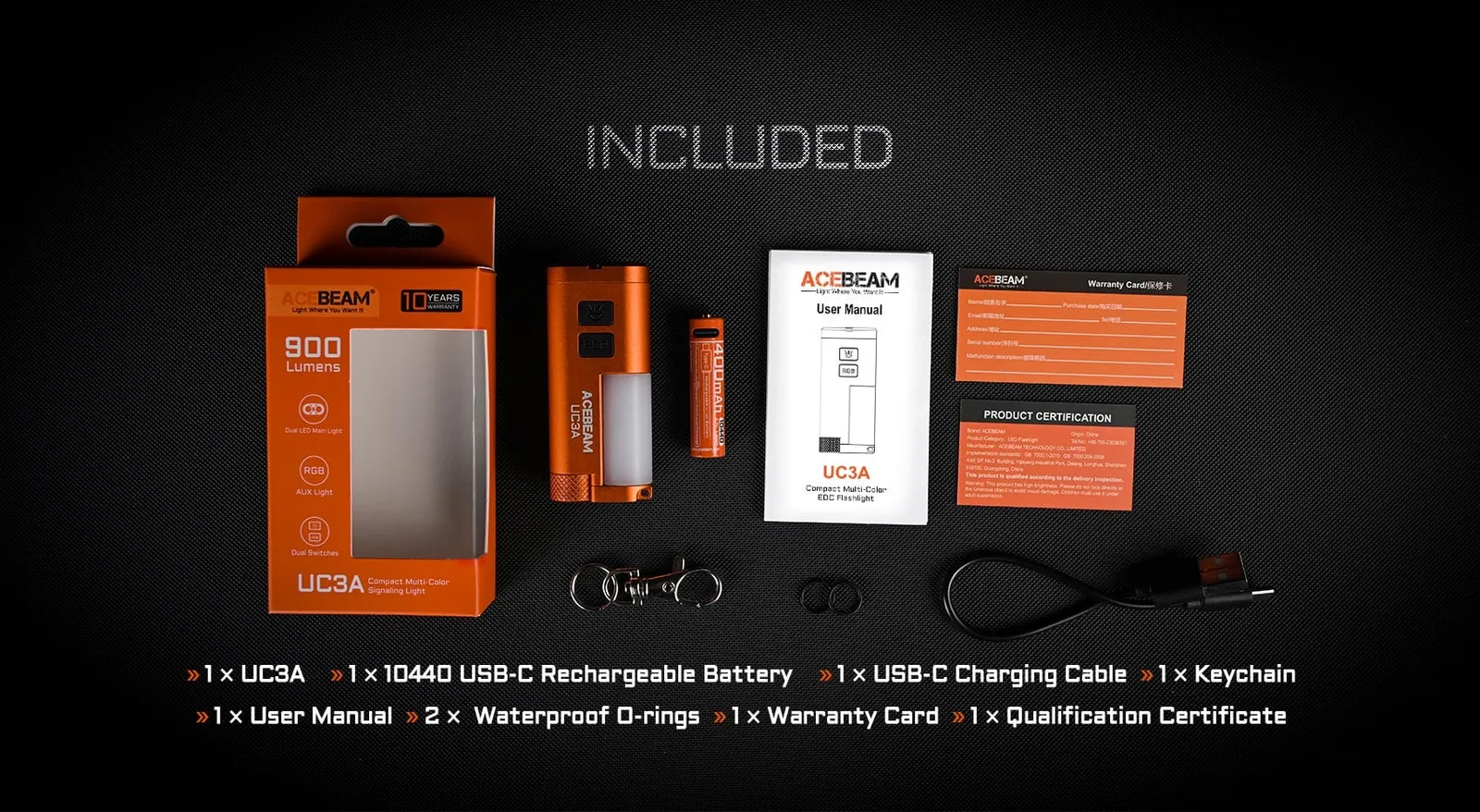 All included accessories and packaging for the Acebeam UC3A - Compact EDC Light with RGB Signals, laid out on a dark surface.