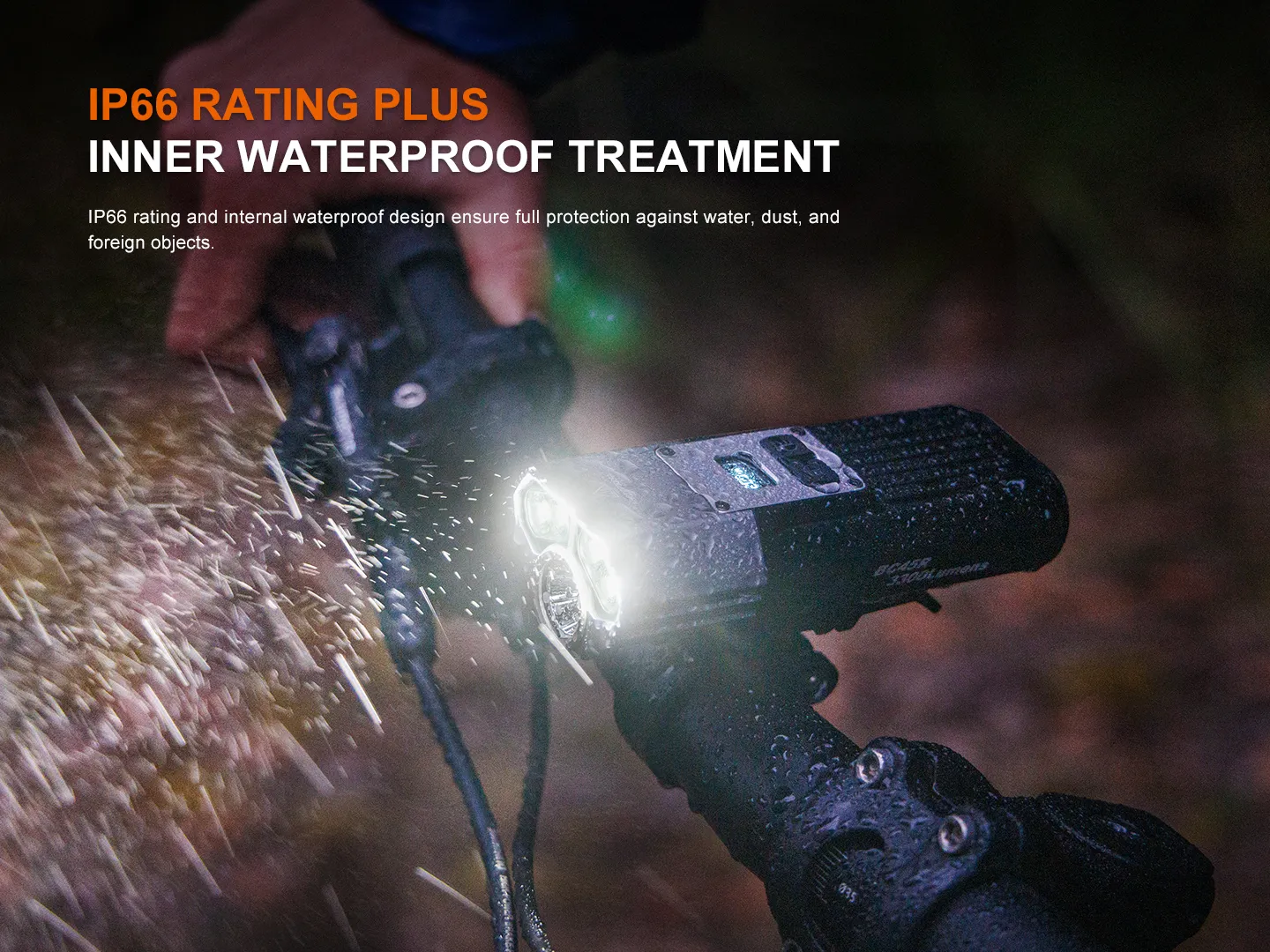 Fenix BC45R bicycle light on handlebars being splashed with water, showcasing its IP66 waterproof rating.