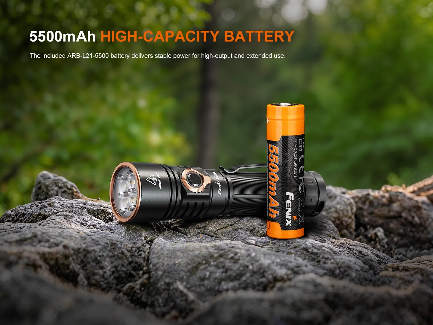 Fenix E40R - 5000 Lumen Rechargeable EDC Torch next to its 5500mAh high-capacity battery on rocks.