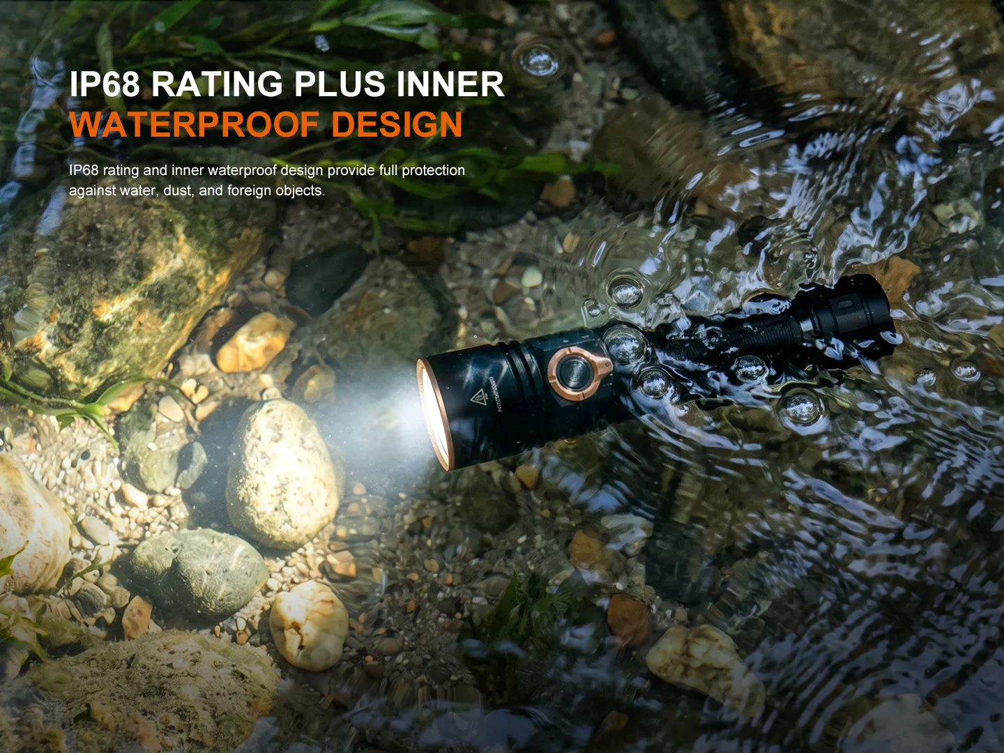 Fenix E40R - 5000 Lumen Rechargeable EDC Torch submerged and glowing in clear water, showcasing its IP68 waterproof design.