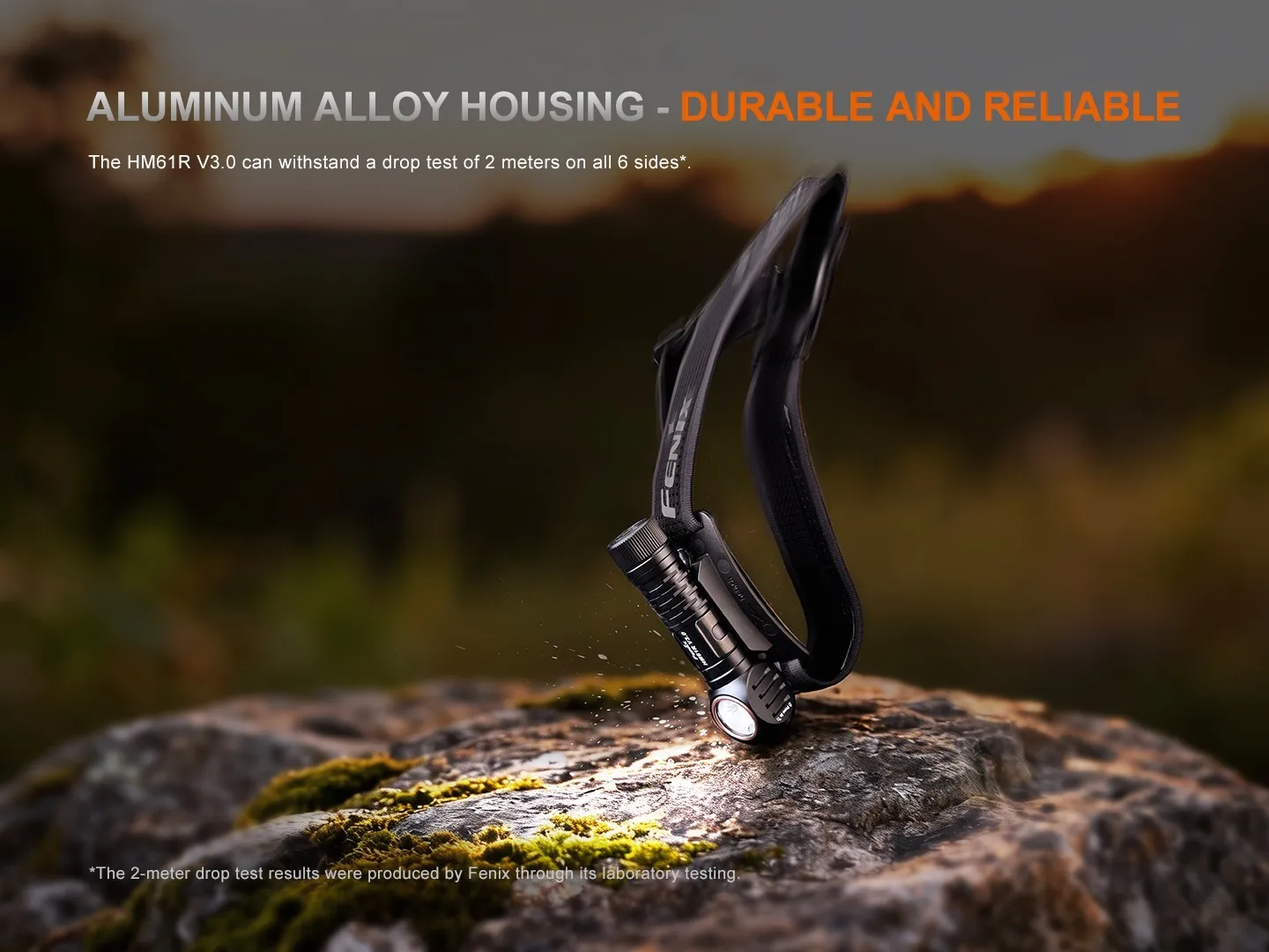 Fenix HM61R V3.0 - 1800 Lumen Spot and Flood LED Headlamp with durable aluminum alloy housing on a rock.