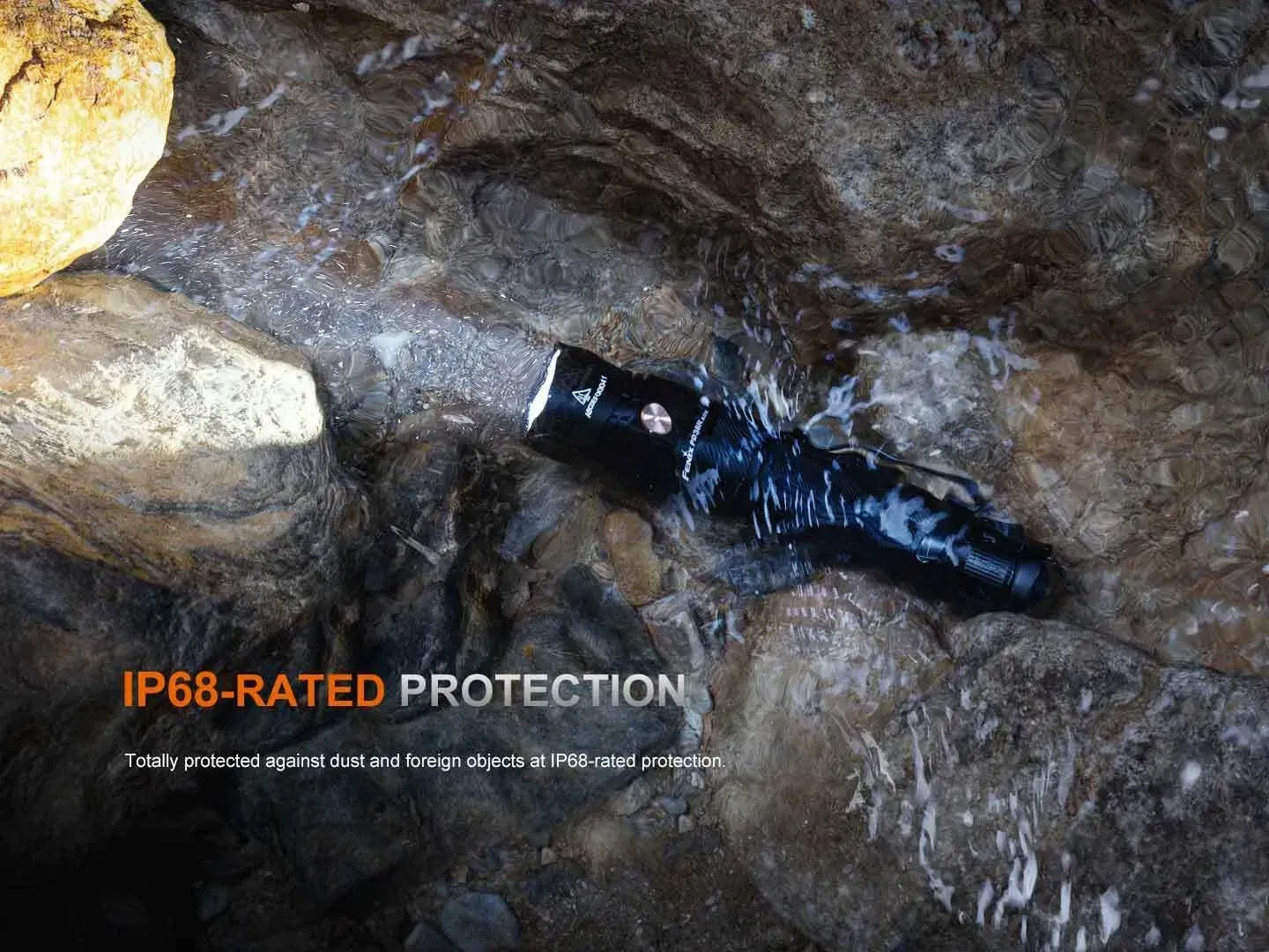Fenix PD36R ACE + Free E12 V3.0 Combo Set flashlight submerged in water, demonstrating IP68-rated protection.