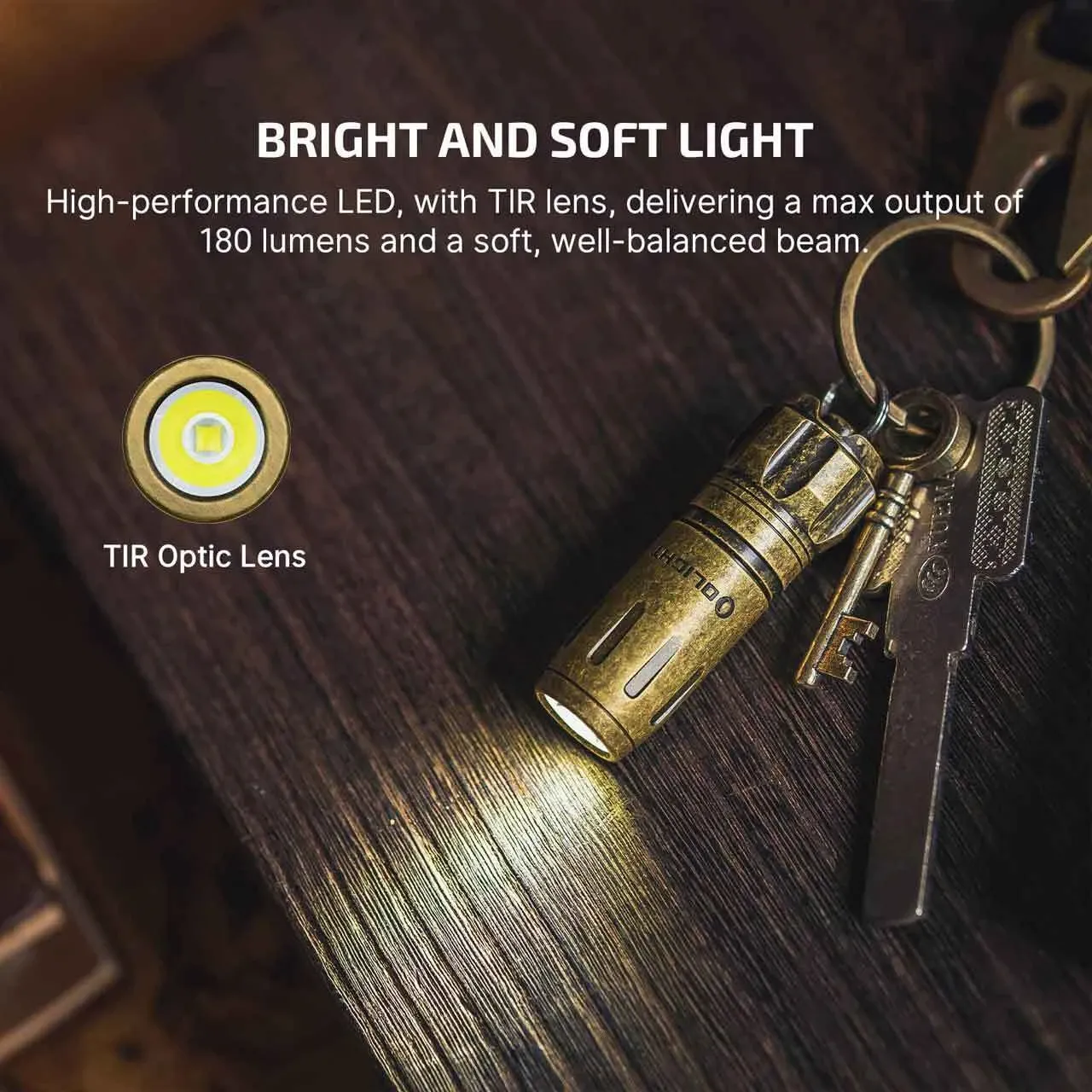 The Olight i18 Brass Limited Edition Keychain Light emits a bright, soft beam, showcasing its TIR optic lens and 180 lumens output.