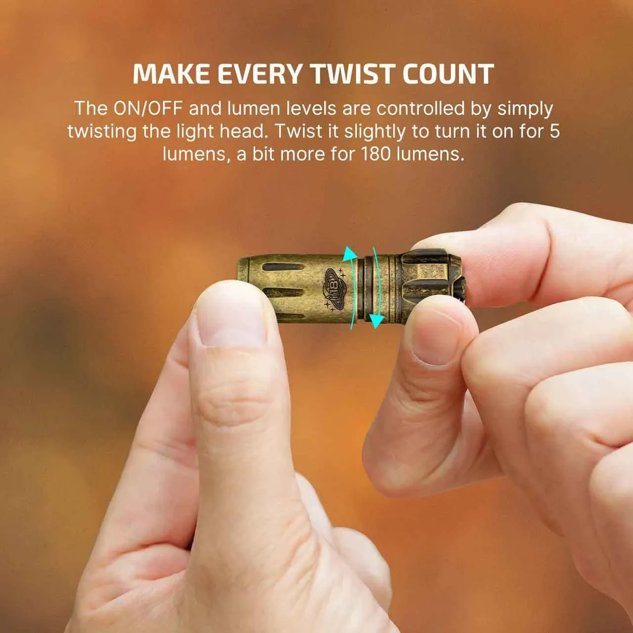 Hands demonstrate twisting the head of the Olight i18 Brass Limited Edition Keychain Light to control ON/OFF and lumen levels.