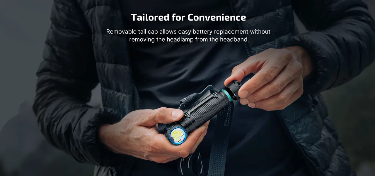 Hands removing the tail cap of the Olight Perun 3 High Performance 3000 lumen rechargeable headlamp for battery replacement.