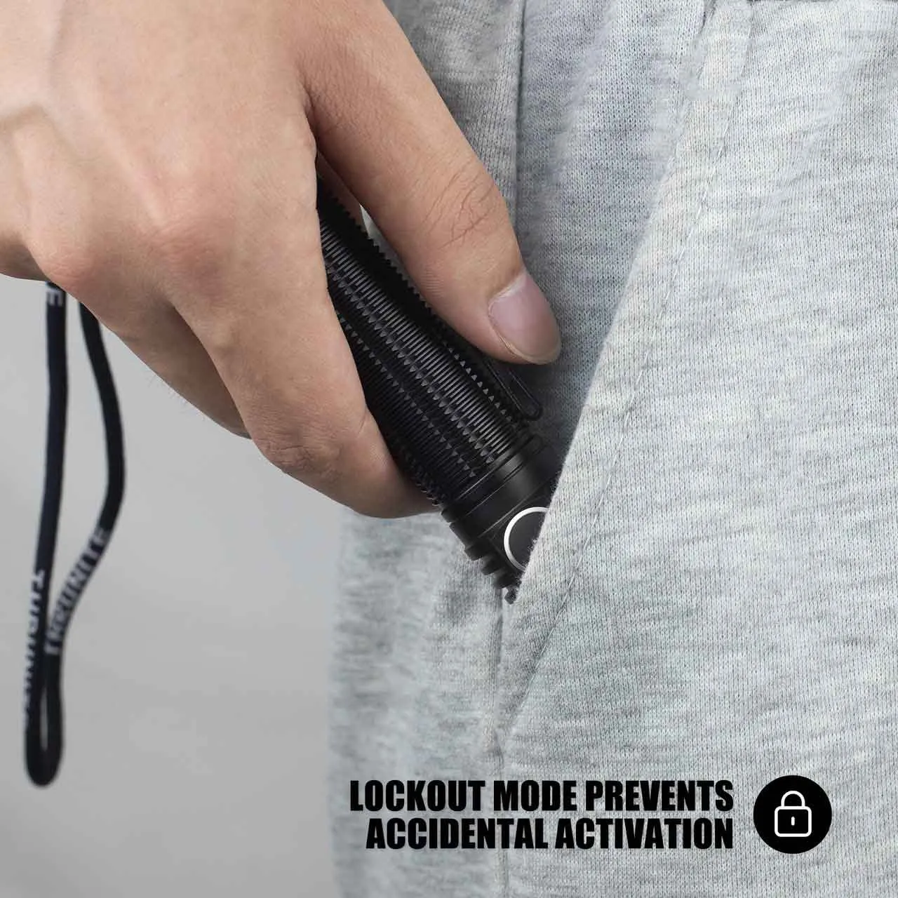 ThruNite T1 Pro 1920 Lumen Compact USB-C Rechargeable LED Torch being placed in a pocket, demonstrating lockout mode.