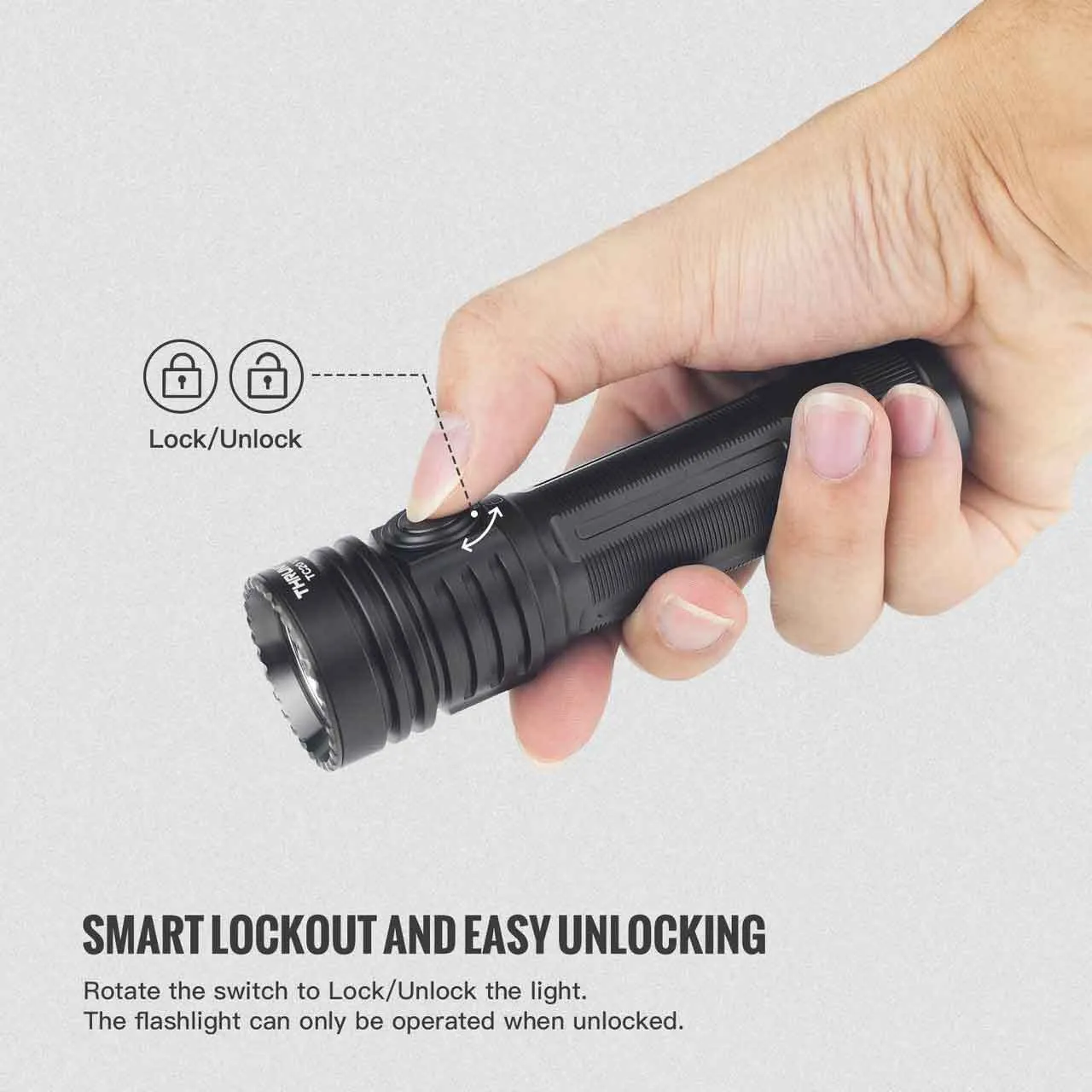 Hand rotating the smart lockout switch on the ThruNite TC20 V3 flashlight to lock or unlock it.