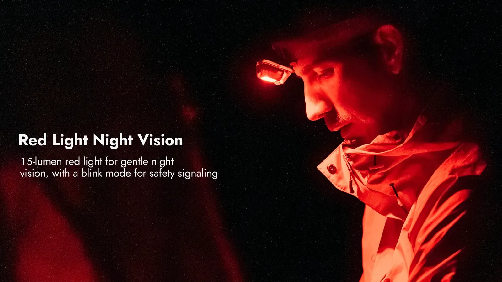 Man wearing the Wuben H4 headlamp emitting red light for night vision and safety signaling.