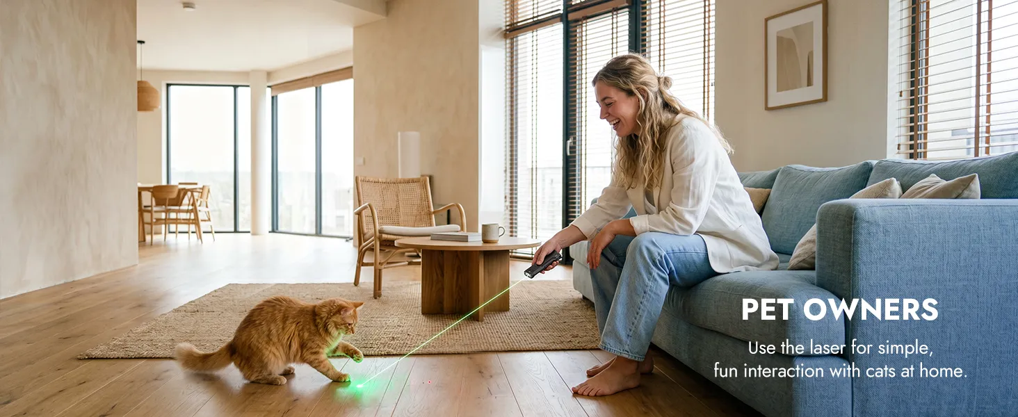 Woman using the Wuben X5 flashlight's green laser to play with a cat in a bright, modern living room.