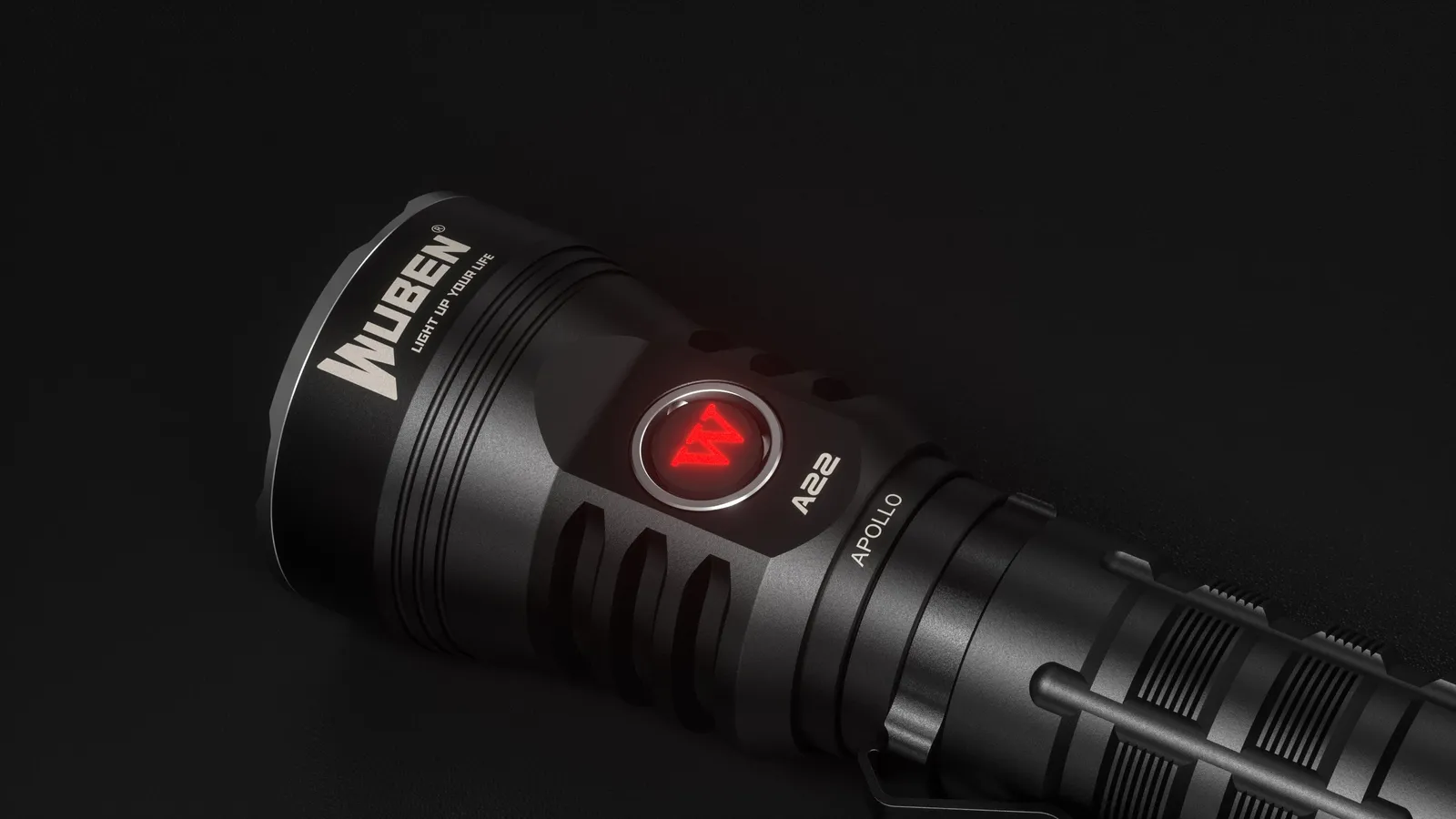 Close-up of the Wubenlight A22 flashlight's side button glowing red, indicating a specific status or low battery.