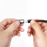 Hands detaching the Klarus KC01 USB C cable 65W fast charging from its lanyard housing.