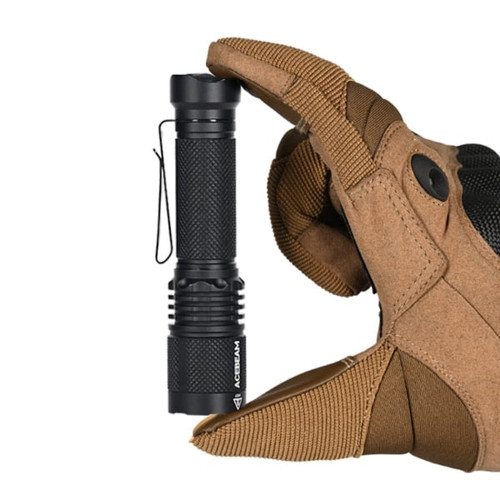 AceBeam TAC AA 2.0 Compact 1000 lumen EDC torch held in a gloved hand, showing its compact size.