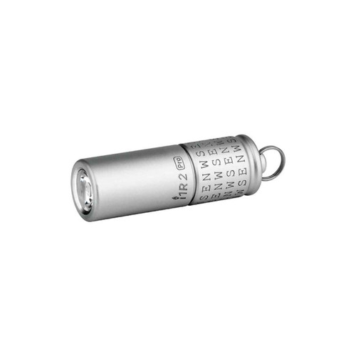 Angled view of the Olight i1R 2 Pro Cardinal Directions Limited Edition 180 Lumen Keychain Light in silver.