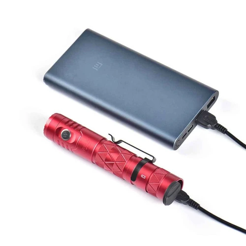Red Wuben E12R flashlight connected via USB-C to a power bank, illustrating its charging capability.