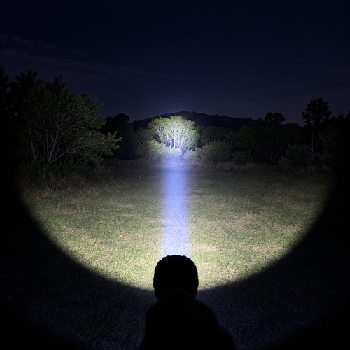 Acebeam P20 Mini - 1035m 4000 Lumen Long-range Tactical Torch illuminating a path at night.