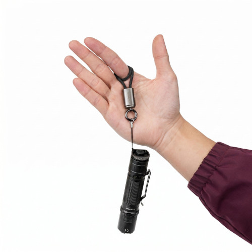 Klarus KC01 USB C cable 65W fast charging lanyard attached to a flashlight, held in a hand.