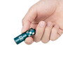 Olight i17 Checkered Flag Limited Edition Rechargeable Keychain Light held in a hand, showcasing its compact and portable size.