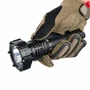 Gloved hand holding the Acebeam P20 Mini long distance tactical flashlight, showing its ergonomic grip.