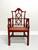 Late 20th Century Red Lacquered Carved Wood & Cane Asian Style Armchair