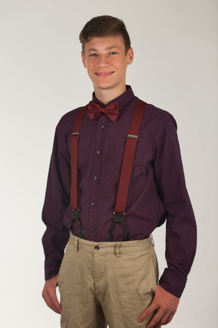 Model wearing bow tie & suspenders