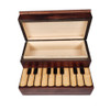Upper part opens up on piano upright wood jewelry box. 