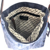 Inside of blue star canvas leather crossbody bag. 
