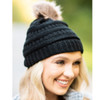 Black ponytail beanie with brown pompom. 