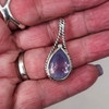 Lavender Quartz sterling silver pendant in my hand. 