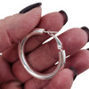 30mm Italian 5mm sterling silver hoop earrings in my hand.  30mm Italian 5mm sterling silver hoop earrings in my hand.