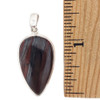 Teardrop-shaped red Tigers Eye sterling silver pendant with a ruler. 