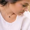 Determined to rise Soulku Black Sunstone necklace on a model. 