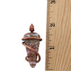 Ocean Jasper stone wrapped in copper wire to make a pendant with a ruler. 