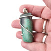 Turquoise cold-forged sterling silver pendant in my hand. 