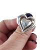 Sterling silver puffy heart ring in my hand. 