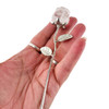 Clear Quartz stone rose on silver stem in my hand. 