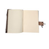 Handmade leather journal with clear quartz stone detail, inside view. 